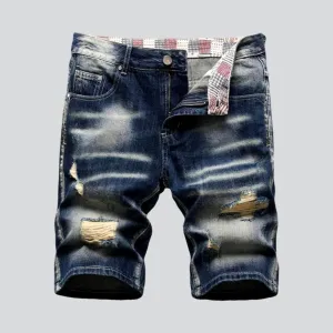 Distressed whiskered men's denim shorts