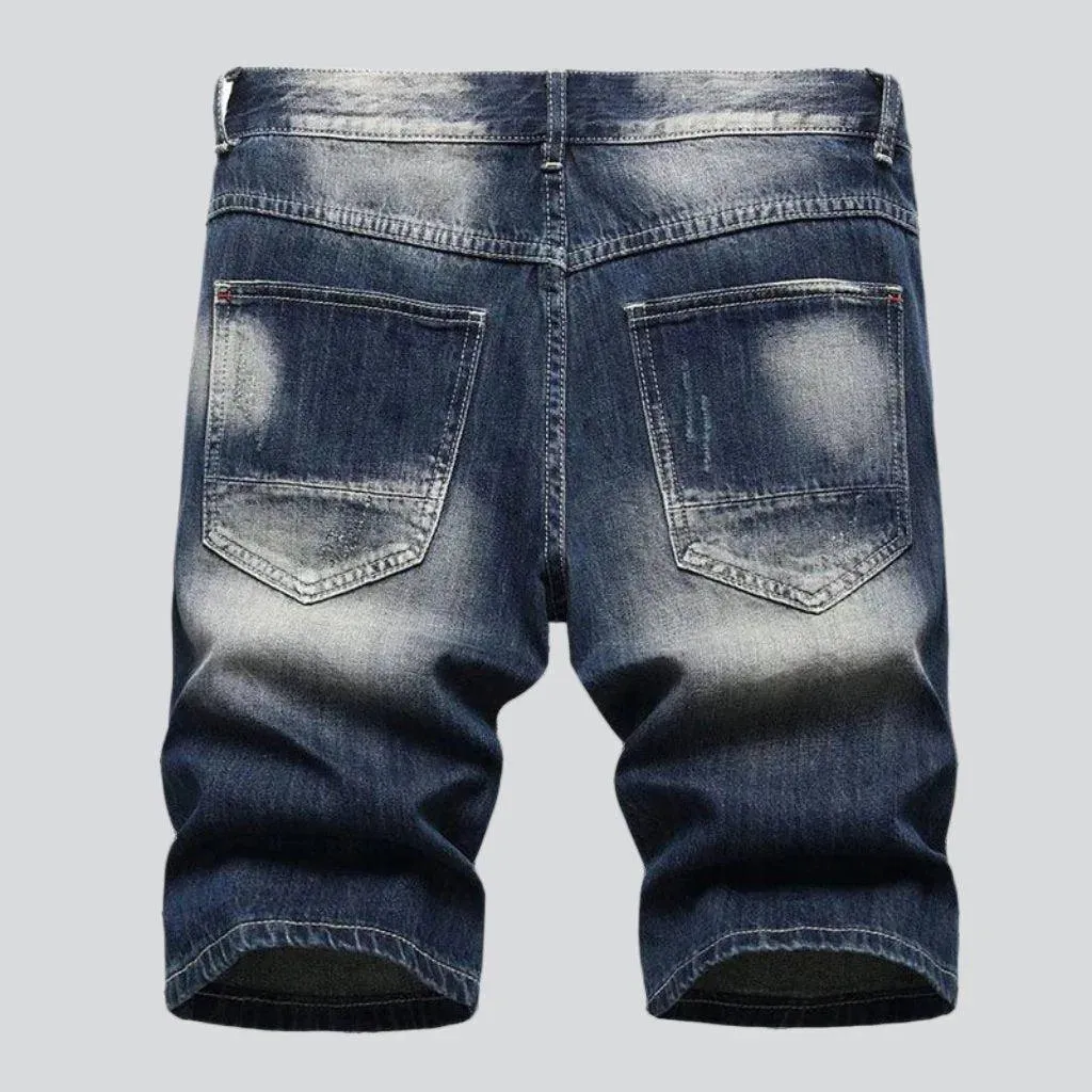 Distressed whiskered men's denim shorts