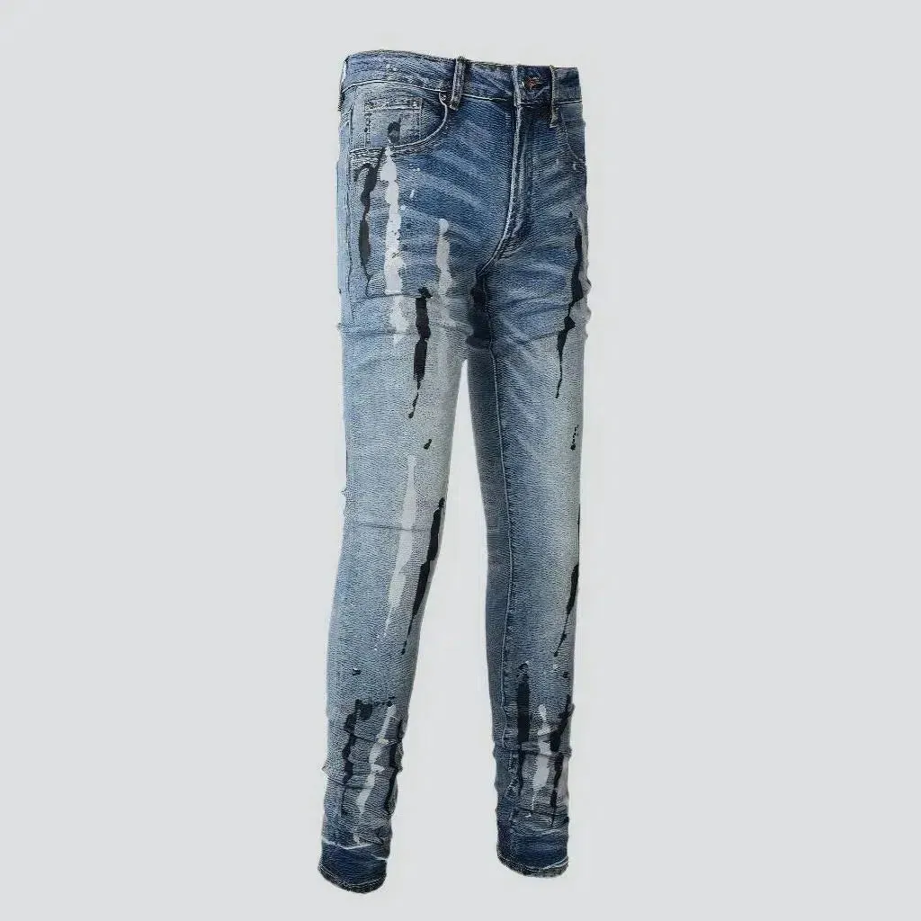 Painted men's light-wash jeans